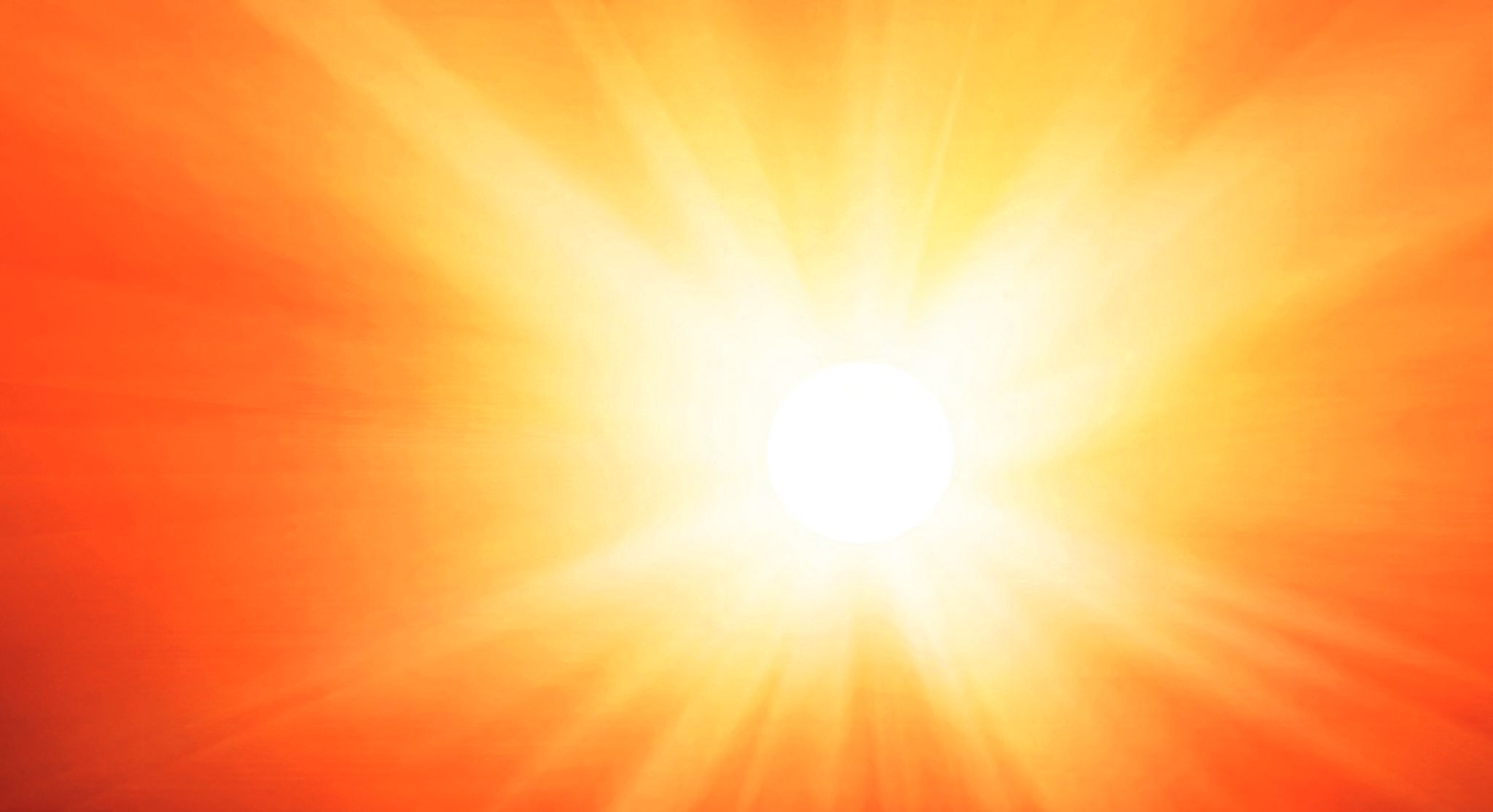 ein hell orangefarbener Hintergrund mit einem hellen Licht in der Mitte