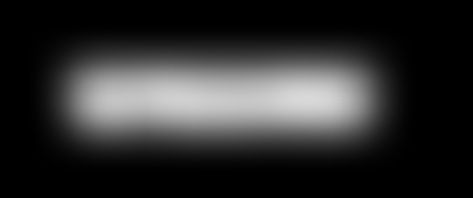 ein schwarz-weißes Bild eines Lichts im Dunkeln