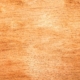 Eine braune Oberfläche, die wie ein Holzkorn aussieht.