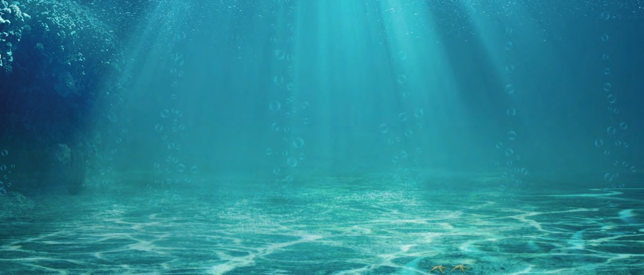 Eine blaue Ozean-Szene mit Sonnenlicht strömend durch das Wasser.