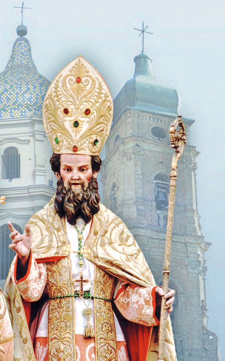 Ein Mann in Priesterkleider und einem hohen Hut.