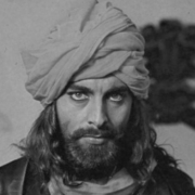 Ein Mann mit einem Turban und einem Bart.